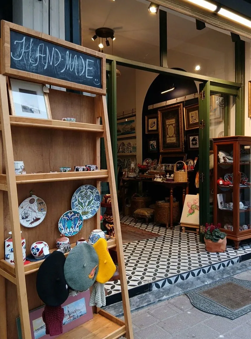 Cozy boutique entrance showcasing handmade crafts on a sunny day.